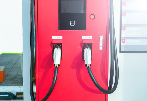 istock Electric car charging station for charge EV battery. Plug for vehicle with electric engine. EV charger. parking lot. Future transport technology. 1478957595