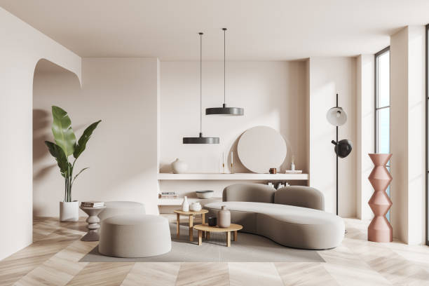 White living room interior with sofa and mirror