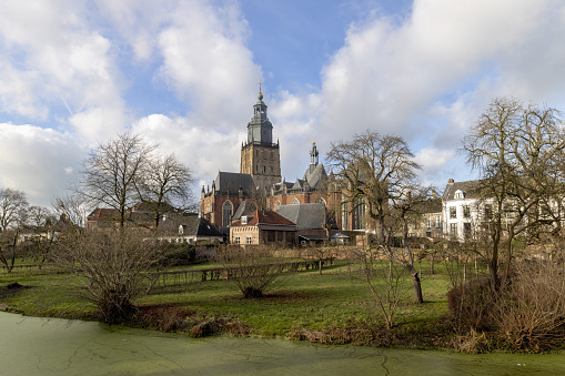 Picturesque cityscape of medieval Hanseatic city Zutphen in The Netherlands with the Walburgiskerk church tower and historic housing surrounding it