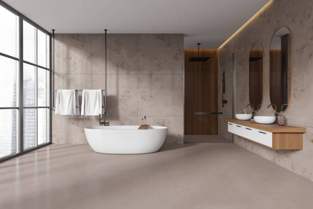 istock Beige bathroom interior with bathtub, double sink and douche, panoramic window 1478960464