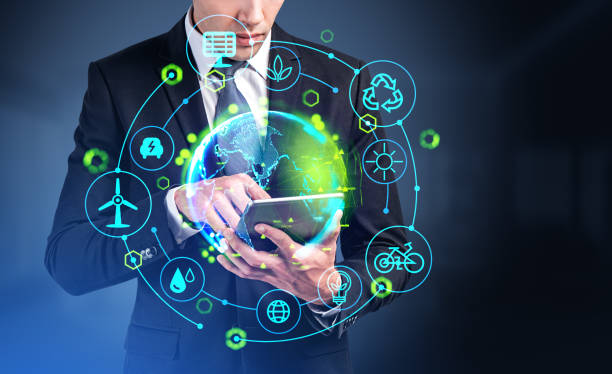 istock Businessman using tablet, earth globe hologram with green energy hud 1478962869