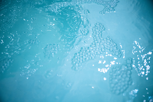 Bubbles on surface of hot tub water
