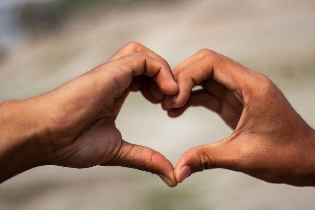 istock Tow young men make a love with their hands. 1478964571