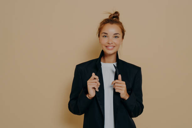 istock Female office worker showing confidence on beige background 1478972137