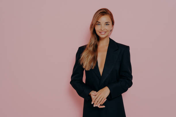 istock Confident boss lady smiling on pink background 1478972186