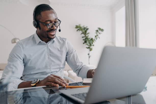 istock Manager of client support service has conversation. Afro american guy speaking in front of camera. 1478976050
