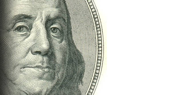 istock Macro close up of Ben Franklin's face on the US $100 dollar bill. 1478976574