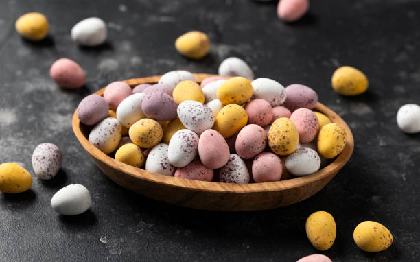 istock Easter mini eggs, chocolate candy in wooden bowl 1478976786