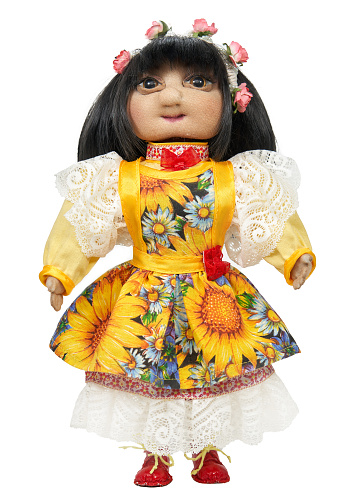 Beautiful folk girl. Handmade textile doll. Isolated on white