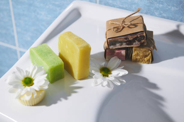 istock Still life with various eco soap and solid shampoo with natural ingredients on a white ceramic surface in the bathroom 1478985668
