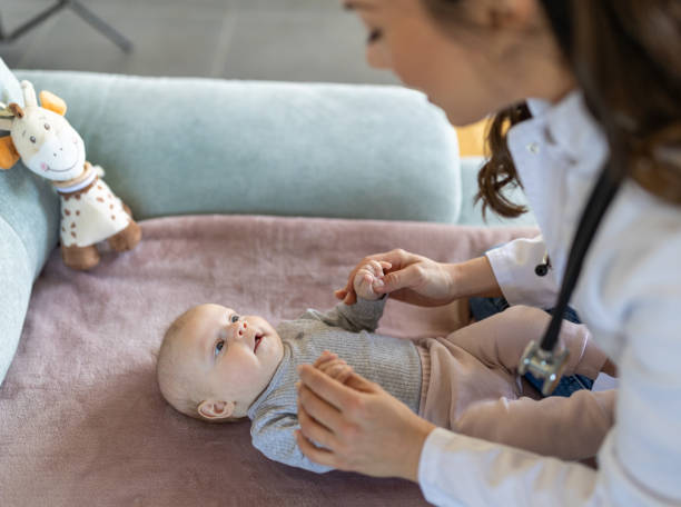 istock Young pediatrician checking little baby 1478994839