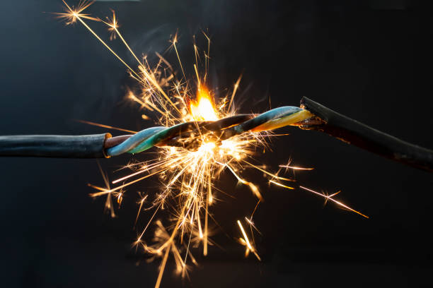 istock flame smoke and sparks on an electrical cable, fire hazard concept 1478994869