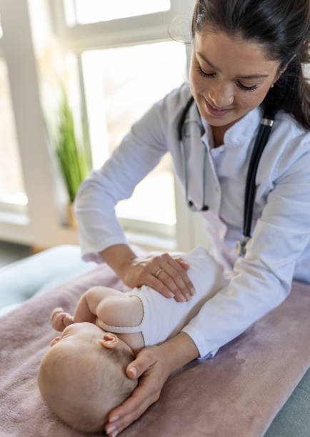 istock Young pediatrician checking little baby 1478994870