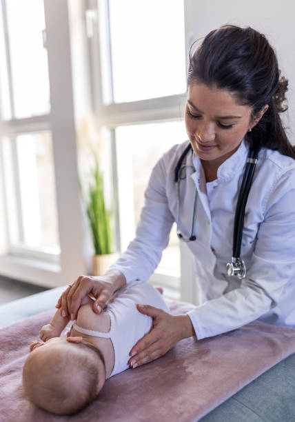istock Young pediatrician checking little baby 1478994874
