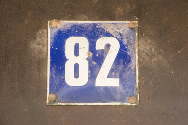 istock Weathered enameled plate number 82 1478995046