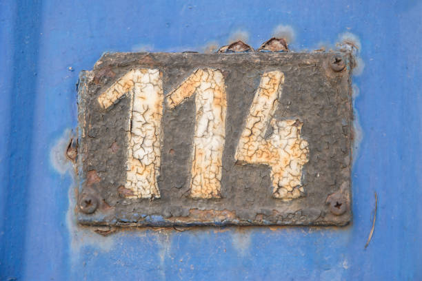 istock Old retro cast iron plate number 114 1478995049