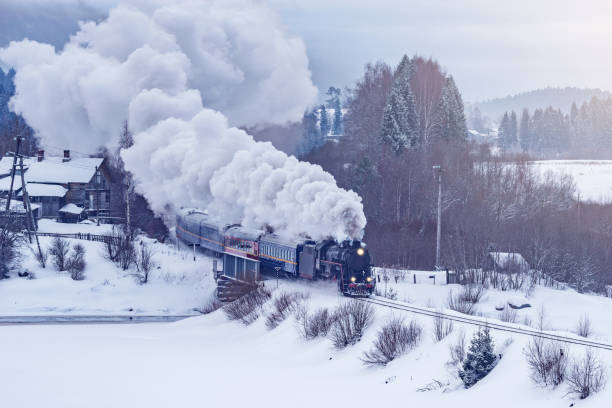 istock Retro steam train moves at winter morning. 1479005869