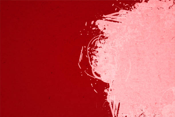 istock Vibrant dark red or maroon coloured  art background with an abstract splatter of contrast light pastel pink colored spray paint graffiti on the right edge of wall 1479011342