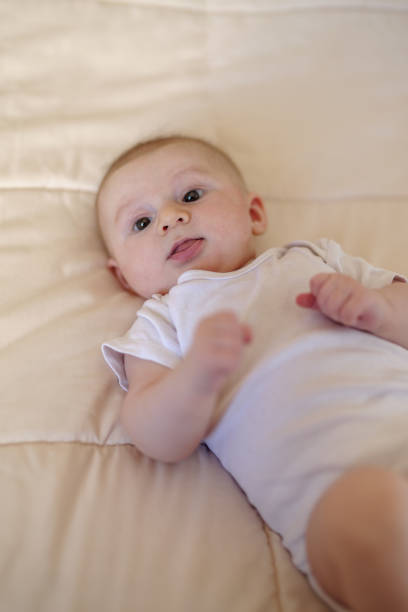 istock Three month baby boy in bed 1479011403