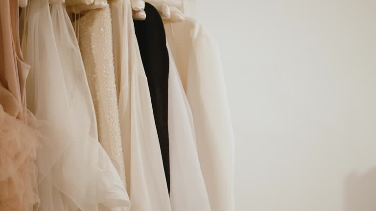 Slow Motion Shot Colorful Female theatrical Shirts Hanging On Hangers On The Rack