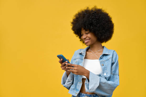 istock A woman using phone in her hand and looking at her phone on isolated background 1479014290
