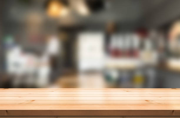 istock Empty wooden table top with lights bokeh on blur restaurant background. 1479015543