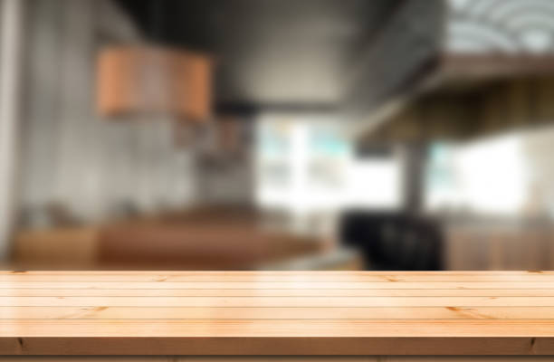 istock Empty wooden table top with lights bokeh on blur restaurant background. 1479015781