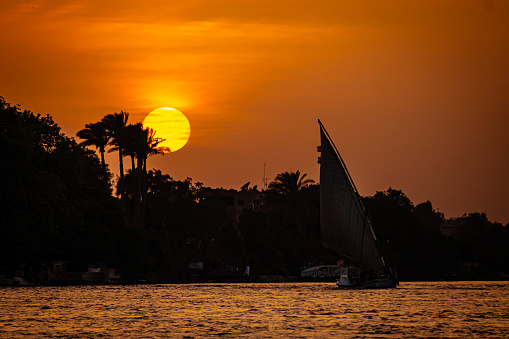Felucca wooden boat in the Nile River at Sunset, Egypt