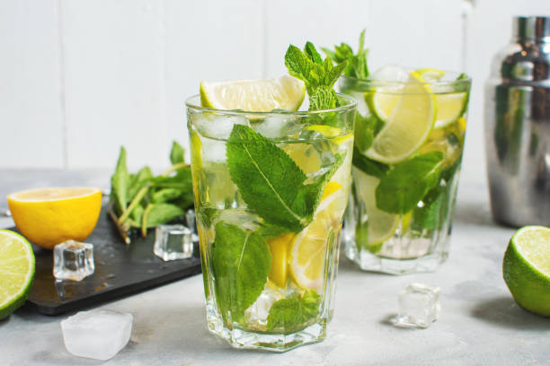 istock Refreshing summer alcoholic cocktail mojito with ice, fresh mint and lime. Top view 1479020615
