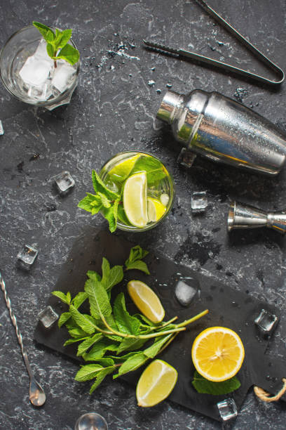 istock Refreshing summer alcoholic cocktail mojito with ice, fresh mint and lime. Top view 1479021306