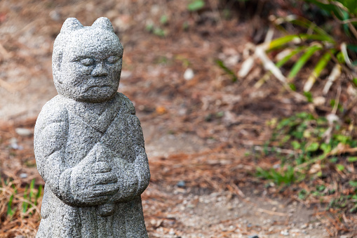 Small stone statue in front of Taejongsa Temple at Taejongdae park, Busan, South Korea