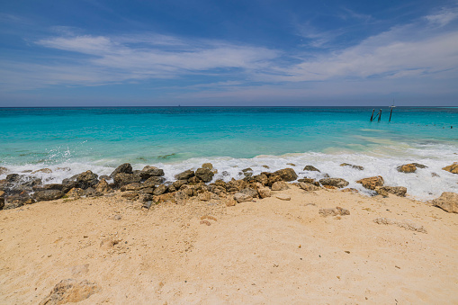 Beautiful view of coastline of beach Atlantic ocean with stones. Aruba.