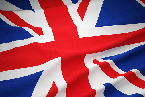 3d illustration flag of United Kingdom. United Kingdom flag isolated on the blue sky with clipping path.