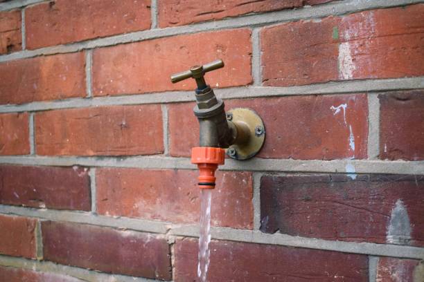 istock Running water from garden tap on a brick wall 1479025830