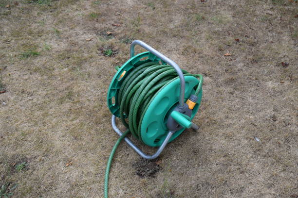 istock Coiled up garden hose reel 1479026204