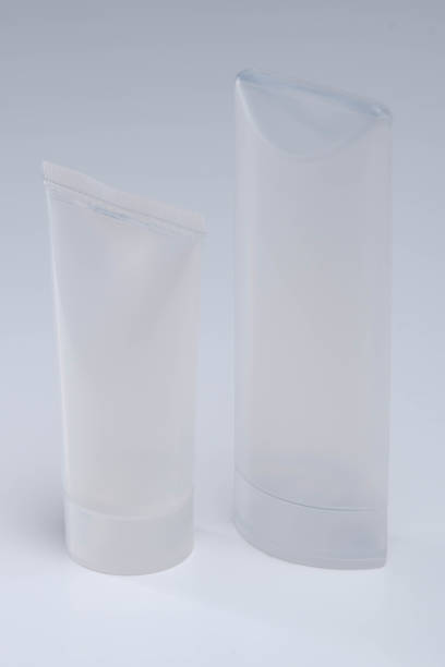 Closeup of unbranded cosmetics containers. Skincare bottles against a bright background. stock photo
