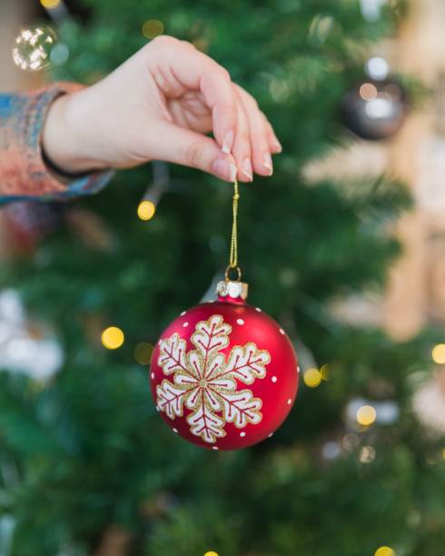 istock Selective of decorations of a Christmas tree in a hand 1479031362