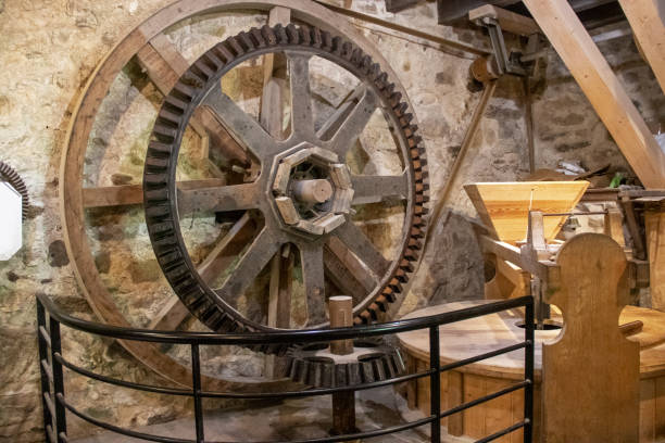 Water mill mechanism Internal mechanism with gears and pulley of a water mill old flour mill stock pictures, royalty-free photos & images