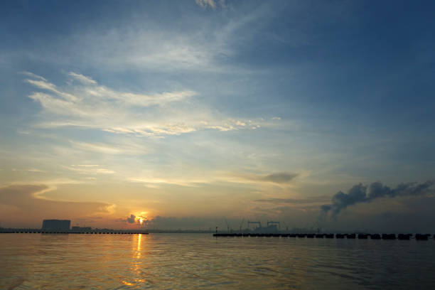 istock A beautiful sunrise with cloudy sky on the beach. 1479044007