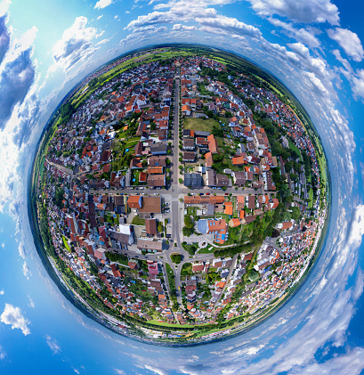 Aerial view of the village Karlsdorf in little planet format on a sunny day in summer