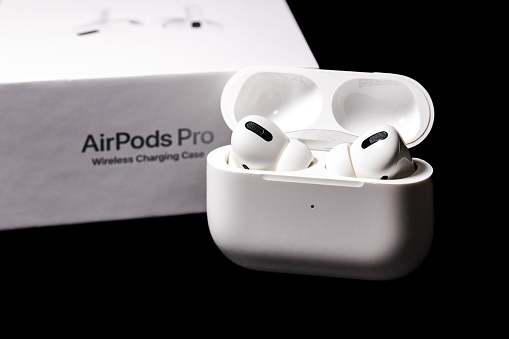 Karlsruhe, Germany – December 11, 2022: The Apple Airpods Pro isolated on black background