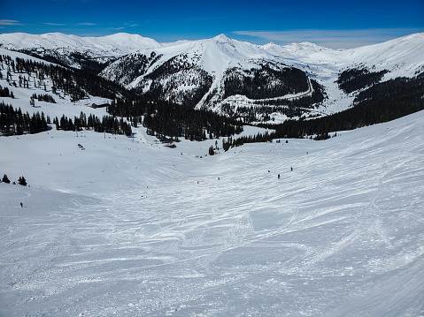View from high on the slopes of Arapaho Basin ski resort, Colorado on a bright sunny day.
