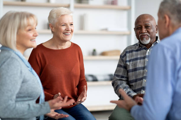istock Excited multiethnic elderly people attending group therapy session 1479052750