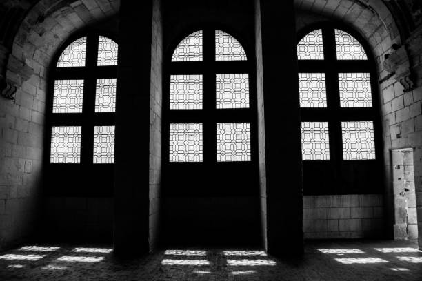 istock Grayscale shot of light reflected behind old mosque windows 1479052988