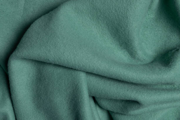 istock Top view green fleece fabric with creases 1479056804