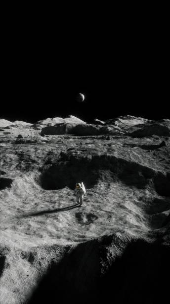 istock Vertical image of a space explorer standing on the moon's surface 1479057396
