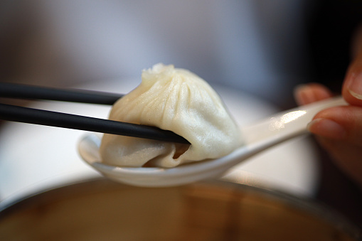 Xiaolongbao refers to a type of small Chinese steamed bun traditionally prepared in a xiaolong, a small bamboo steaming basket, hence the name.