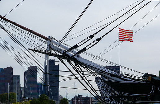 Boston, United States – July 11, 2007: Old navy ship the USS Constitution with downtown Boston in the background