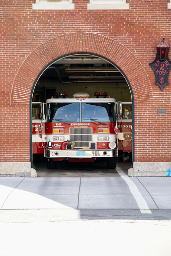 Cambridge, United States – July 18, 2007: Vertical shot of a fire truck in a fire station in Cambridge near Boston