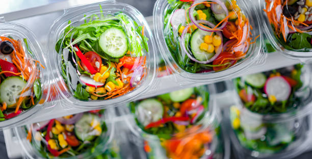 istock Boxes with pre-packaged vegetable salads in a commercial fridge 1479067439